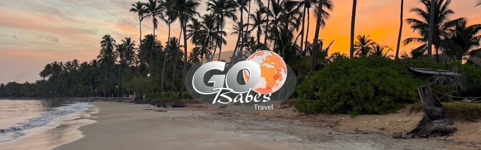 GO Babes Travel hero image of a tropical beach at sunset, symbolizing women’s travel, connection, and adventure in beautiful destinations.